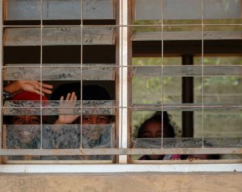 Kids looking Through the Window