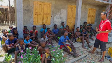 Hasina sharing the Gospel to a group of young people