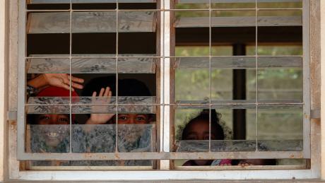 Kids looking Through the Window