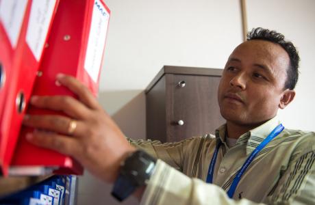man holding binder folder